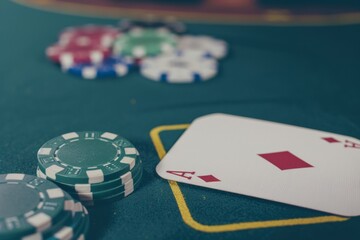 Close Up of Ace of Diamonds and Poker Chips on Green Felt Table Top, Casino Game Playing Cards