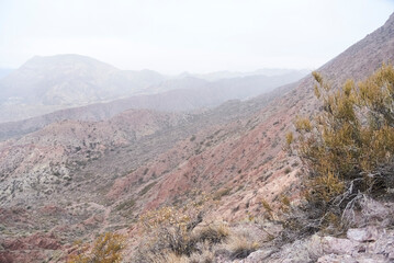 Andean misty scenery in the province of Mendoza, Argentina. Layers of mountains can be seen in the fog.