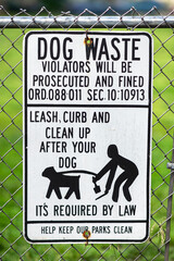  A Dog waste sign is posted in Newark,NJ advising owners to clean up after their dog...