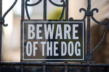Beware of Dog Sign on Fence
