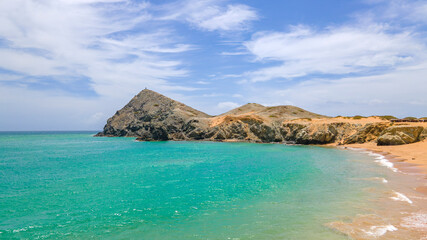 A Scenic View of Cabo de la Vela’s Pristine Beach and Mountains in La Guajira, Colombia