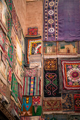 Carpets on the walls outside the terracotta houses in Kashgar Old Town, Xinjiang, China