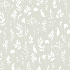 Floral seamless pattern. White silhouettes of wild grasses, twigs, leaves and flowers on a grey background. Monochrome two-colour pattern for textile