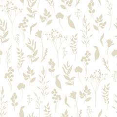 Floral seamless pattern. Beige silhouettes of wild grasses, twigs, leaves and flowers on a white background. Monochrome two-colour pattern for textile