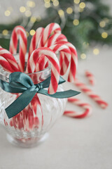 Christmas candy canes in a glass jar closeup