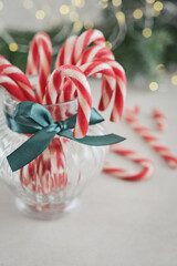 Christmas candy canes in a glass jars closeup