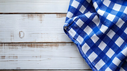 Blue and White Checkered Tablecloth Draped on White Wooden Surface