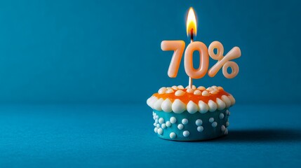 Celebrating 70 Off Festive Blue and Orange Cupcake with Lit Number Candle 70 on Blue Background