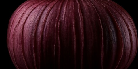 Naklejka premium Detailreiche Nahaufnahme einer violetten Zwiebel mit intensiver Textur vor schwarzem Hintergrund