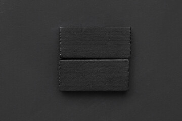 Black blocks on dark background. Rules concept
