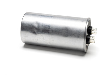 air conditioner's compressor capacitor isolated on white background. Usually found on outdoor unit.