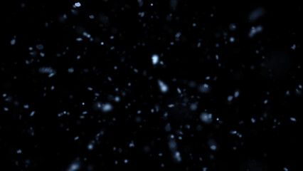 Winter freeze motion of blue snow coming down, isolated on black background. Snowfall texture overlays.