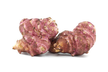 Close-Up of Fresh Pink Jerusalem Artichokes on White Background