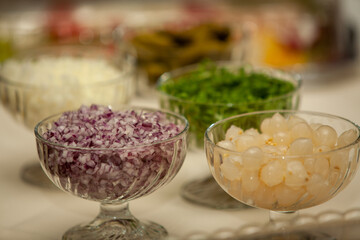 A vibrant array of fresh and colorful ingredients arranged in bowls, perfect for enhancing various dishes