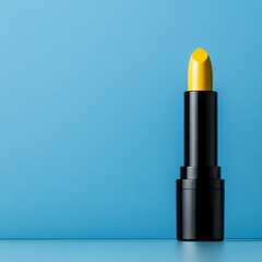 Obraz premium Vibrant Yellow Lipstick Against Bright Blue Background Display