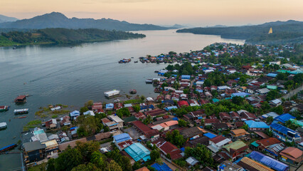 drone fly above famous wooden bridge in Mon village in Sangkhlaburi Thailand Aerial