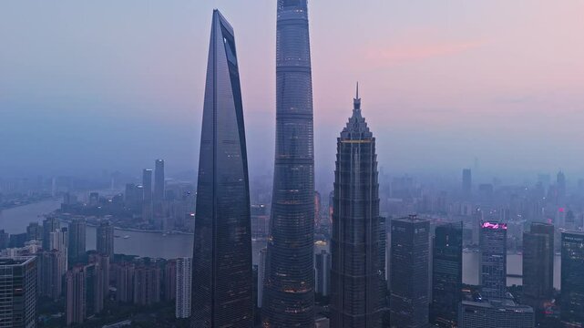 4K real time Aerial View of Shanghai skyline at sunset with the Winding Huangpu River background.