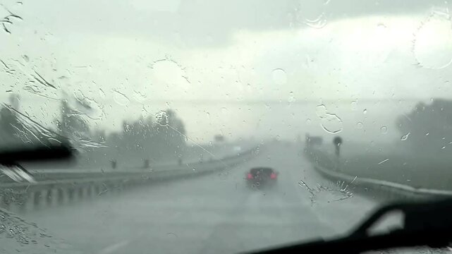 a downpour on the car window, the work of the wipers