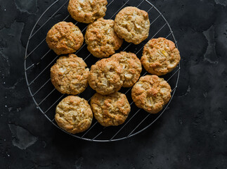 Soft apple cookies on a dark background, top view
