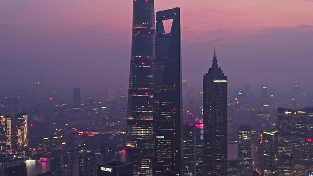 4K real time Aerial View of Shanghai skyline at night with the Winding Huangpu River background.