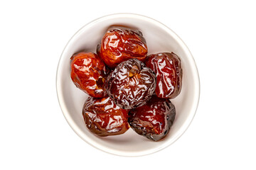 Top view pile of sweet pitted chinese jujube fruit preserved in syrup in white ceramic bowl isolated on white background with clipping path