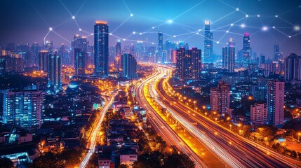 Fototapeta premium A Nighttime Aerial View of a Modern City Skyline Illuminated by Streetlights and Buildings