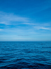 Obraz premium Landscape photography beautiful summer season vertical horizon tropical shore open sea cloud clean blue sky background calm nature ocean wave water nobody travel at Koh Muk Trang Thailand sun day time