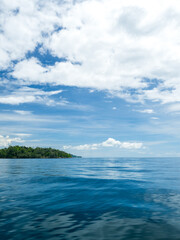 Landscape photography beautiful summer season vertical horizon tropical shore open sea cloud clean blue sky background calm nature ocean wave water nobody travel at Koh Muk Trang Thailand sun day time