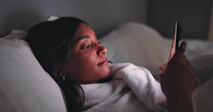 Night, bed and woman with smartphone for social media, scroll comment and chat with online contact. Home, female person and typing with mobile app for dating website, text message and relax in house