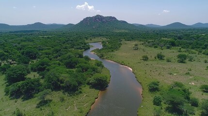 Scenic River Winding Through Lush Green Valley and Mountains