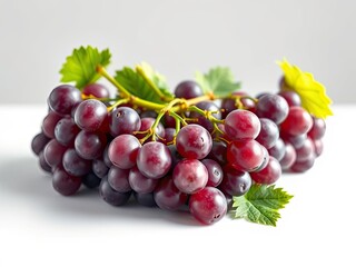 Fototapeta premium Close-up of plump purple grapes with green stems and leaves on a white surface, natural, close-up, grapes