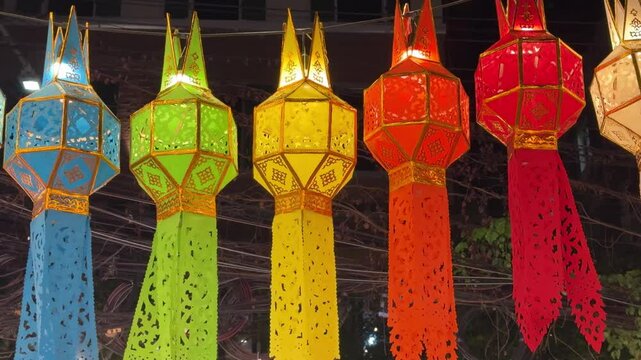 Thailand loi krathong yi peng festival hanging colorful paper lanterns over entrance	