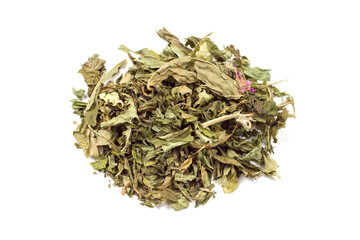 Dried chopped mint on a white background. Fragrant mint leaves are isolated.