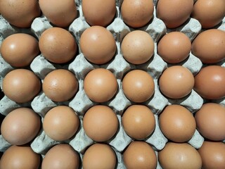 A pile of chicken eggs on display in a supermarket 
