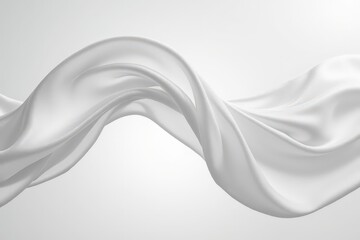 Elegant flowing white fabric on minimalist background with soft lighting.