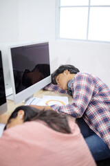 Fototapeta premium Tired Asian Students Sleeping In Classroom