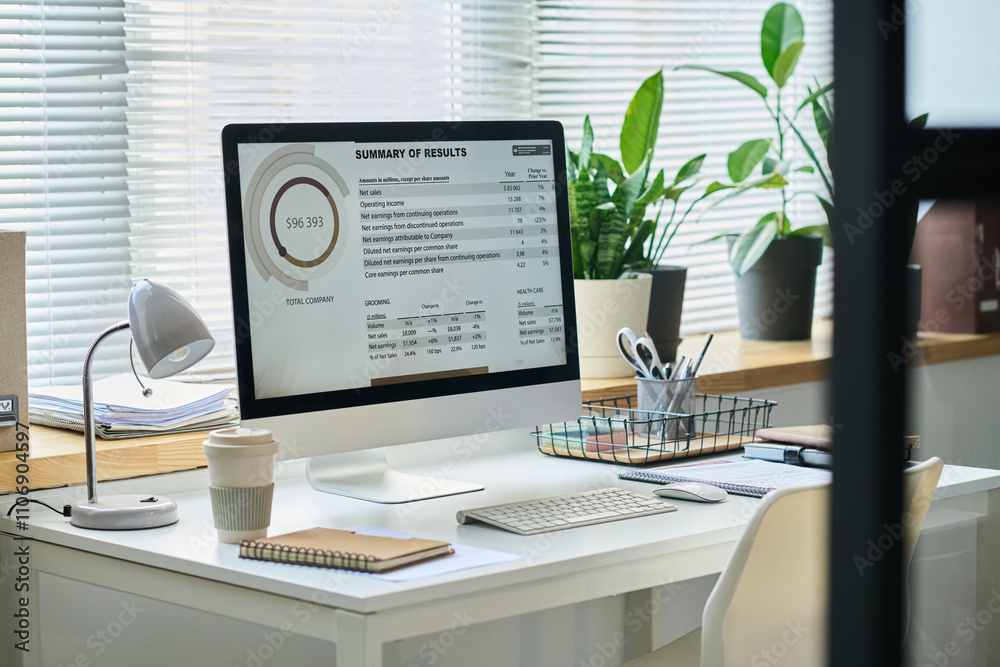 Aufkleber graphic financial data on screen of desktop computer on workplace of financial analyst with cup of c