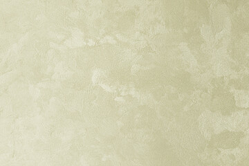 Texture of golden decorative plaster or concrete. Grunge background for design.