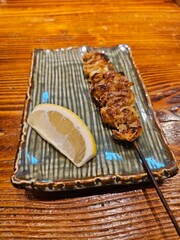 Japanese yakiniku's chicken skin skewer and lemon