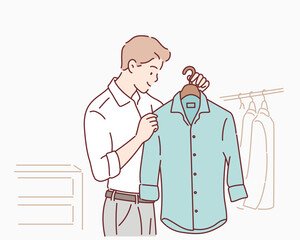 Man looks for clothes at fashion shop. Hand drawn style vector design illustrations.