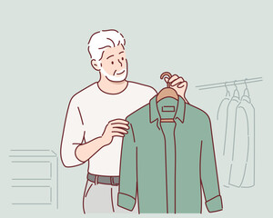 Oldman looks for clothes at fashion shop. Hand drawn style vector design illustrations.