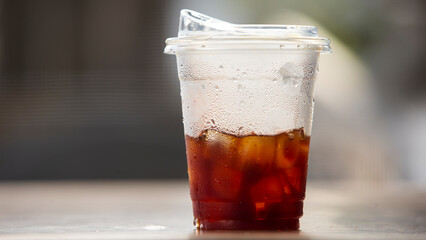 ice coffee in plastic cup on table
