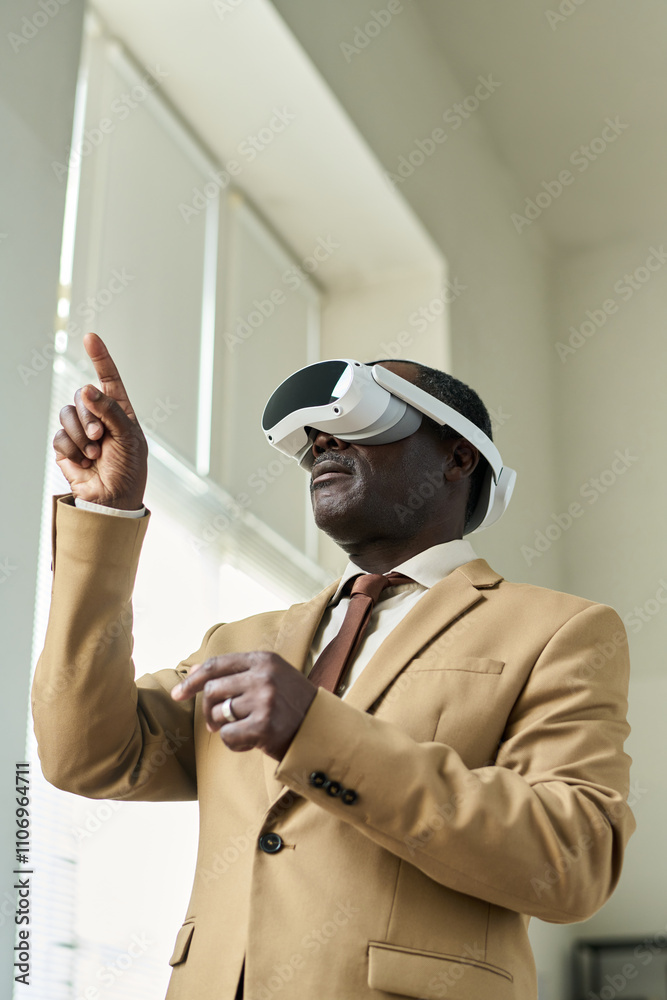 Poster Professional male broker or trader in elegant suit pointing at virtual board with data while working over new business project