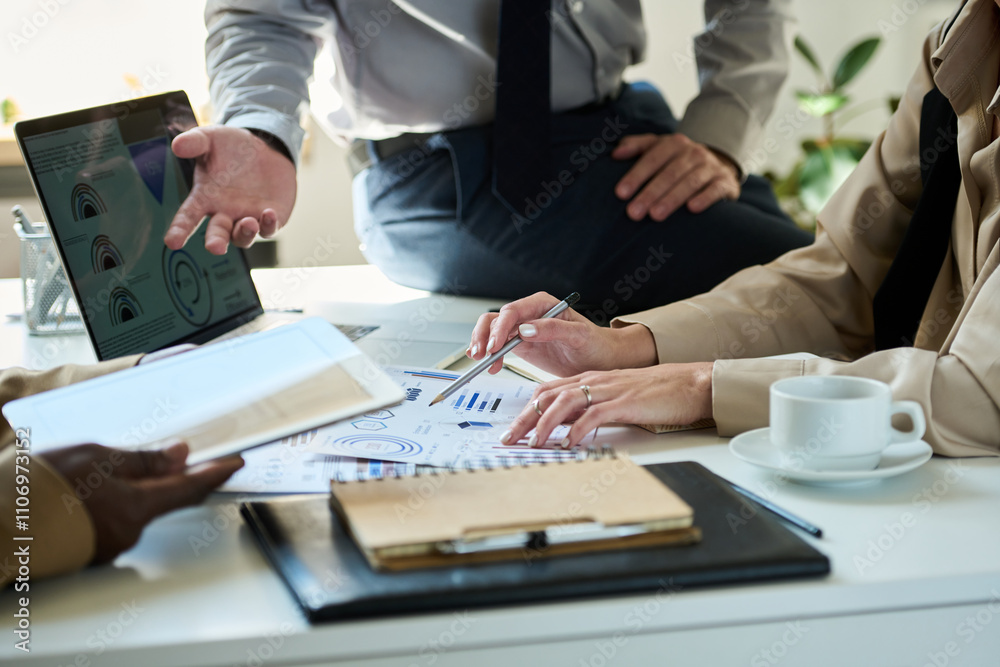 Poster focus on hands of young unrecognizable female broker pointing at paper document with financial graph