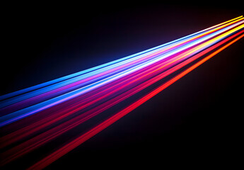 A vibrant light beam with multiple colors of red, blue, and purple against a black background.