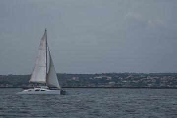 Sailboat Cruising Near the Coastline of Sète, France