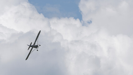 Light single-engine aircraft in the sky. space for text, banner