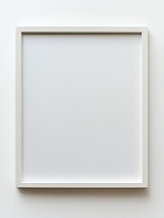 Fototapeta premium White frame with a white background. The frame is empty and has no picture or decoration. The white background gives a sense of calmness and simplicity