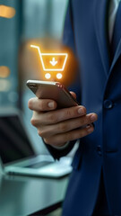 A businessman holds a smartphone displaying a shopping cart icon, symbolizing online shopping. Ideal for e-commerce, digital marketing, and retail industry content, copy space, blank