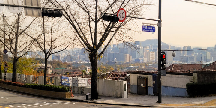 Autumnal street view of Jongno with a cityscape in the background, in Seoul, Korea, in a peaceful and serene atmosphere